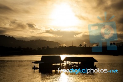 Silhouettes Of River Rafting Stock Photo