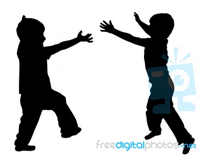 Silhouettes Of Two Little Boys Stock Photo