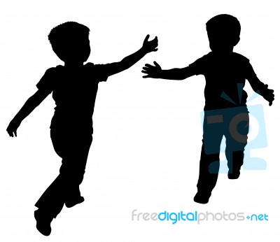 Silhouettes Of Two Little Boys Stock Photo