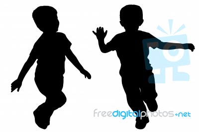 Silhouettes Of Two Little Boys Stock Photo