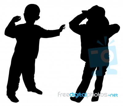 Silhouettes Of Two Little Boys Stock Photo