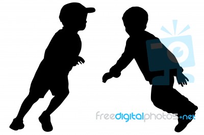 Silhouettes Of Two Little Boys Stock Photo