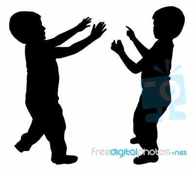 Silhouettes Of Two Little Boys Stock Photo