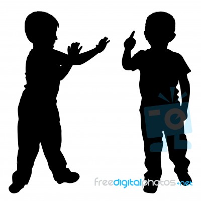 Silhouettes Of Two Little Boys Stock Photo