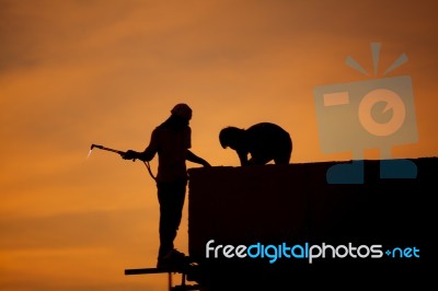 Silhouettes Of Worker Welder Stock Photo