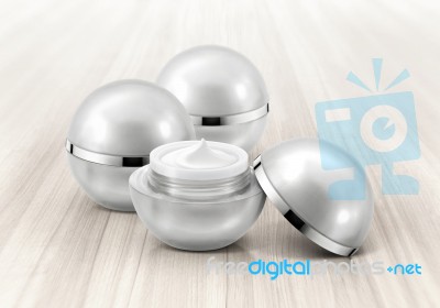 Silver Sphere Cosmetic Jar On Wood Background Stock Photo