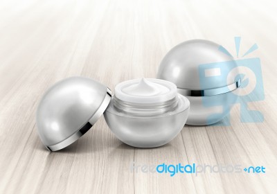 Silver Sphere Cosmetic Jar On Wood Background Stock Photo