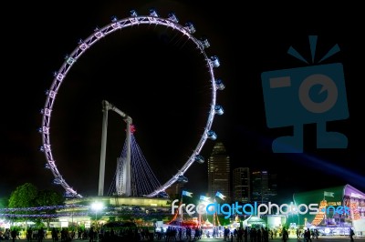 Singapore Flyer Illuminated At Night Stock Photo