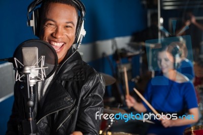 Singer Recording A Song In Studio Stock Photo