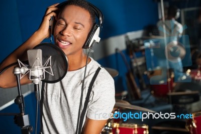 Singer Recording A Track In Studio Stock Photo