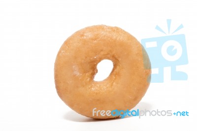 Single Donut Over White Background Stock Photo