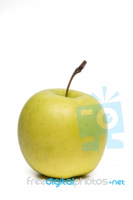 Single Fresh And Healthy Yellow Apple Stock Photo