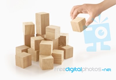 Single Hand Playing Wooden Box On Isolated Background Stock Photo