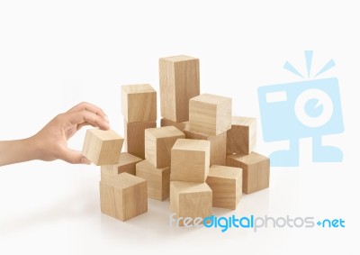 Single Hand Playing Wooden Box On Isolated Background Stock Photo