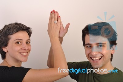 Sister And Brother High Five Stock Photo