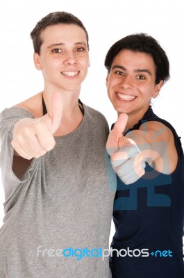 Sisters Showing Thumbs Up Stock Photo