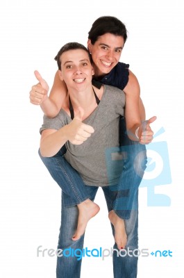 Sisters Showing Thumbs Up Stock Photo