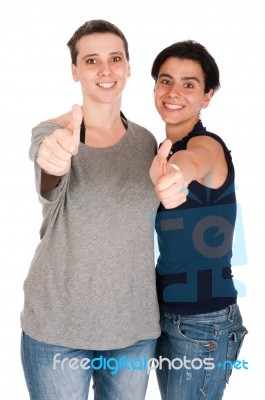 Sisters Showing Thumbs Up Stock Photo