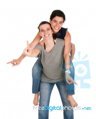 Sisters Showing Victory Sign Stock Photo