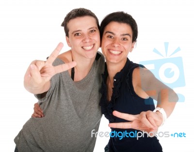 Sisters Showing Victory Sign Stock Photo