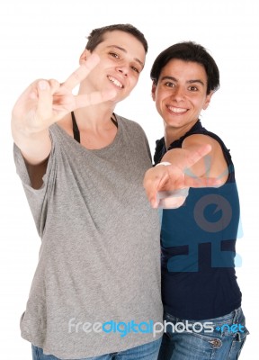 Sisters Showing Victory Sign Stock Photo