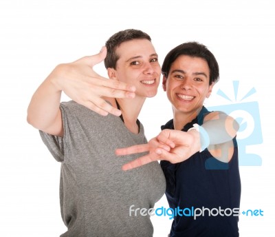 Sisters Showing Victory Sign Stock Photo