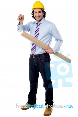 Site Engineer Holding Building Plan And A Key Stock Photo