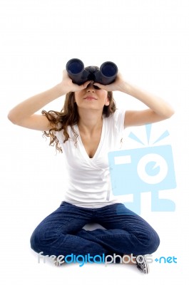 Sitting Female Looking Through Binocular Stock Photo