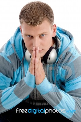 Sitting Man With Headphone Looking At You Stock Photo