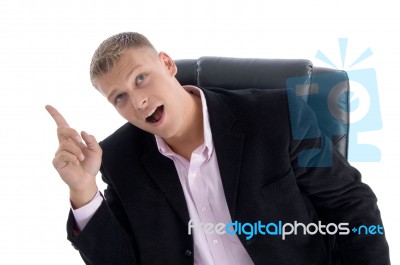 Sitting Manager Indicating Upward Stock Photo