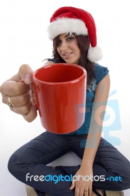 Sitting Woman Showing Coffee Mug Stock Photo