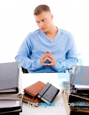 Sitting Young Professional Looking Aside Stock Photo