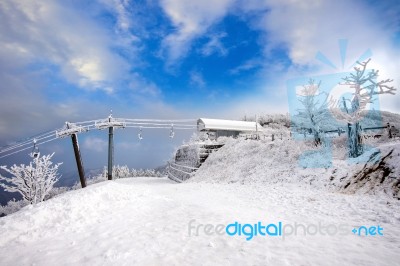 Ski Chair Lift Is Covered By Snow In Winter,deogyusan Mountains In South Korea Stock Photo