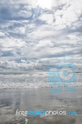 Sky Reflected In The Sand Stock Photo