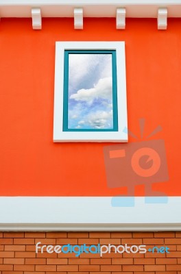 Sky Reflection In Window Glass On Orange Wall Stock Photo