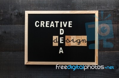 Slate With The Words Creative, Idea And Design Stock Photo