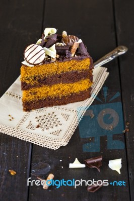 Slice Of Chocolate And Toffee Layer Cake Stock Photo