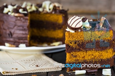 Slice Of Chocolate And Toffee Layer Cake Stock Photo