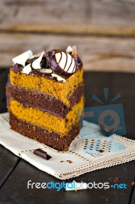 Slice Of Chocolate And Toffee Layer Cake Stock Photo