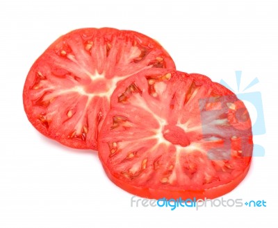 Slice Of Tomato Isolated On White Background Stock Photo