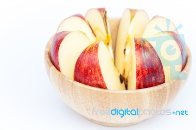 Sliced Apple In Wooden Bowl Stock Photo