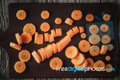 Sliced Carrots On The Wooden Board Top View Stock Photo