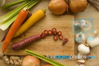 Sliced Carrots Surrounded By Vegetables Stock Photo