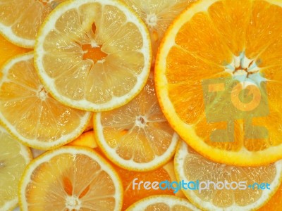 Slices Of Fresh Orange And Lemon Texture Background Stock Photo