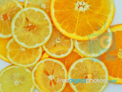 Slices Of Fresh Orange And Lemon Texture Background Stock Photo