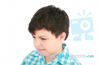 Small Boy In Frowning Mood Stock Photo