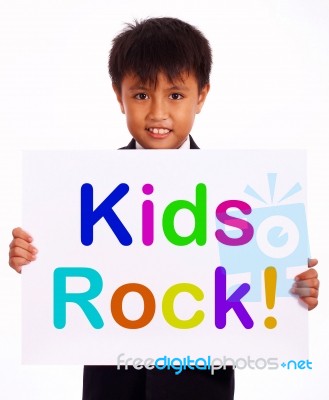 Small Boy With Kids Rock Board Stock Photo