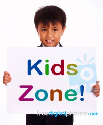 Small Boy With Kids Zone Board Stock Photo