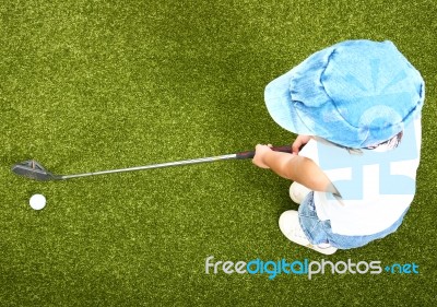 Small Child Playing Golf Stock Photo