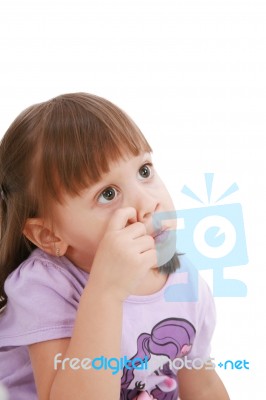 Small Child Scratching Her Nose Stock Photo